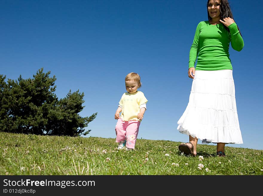 Active family on green meadow. Active family on green meadow