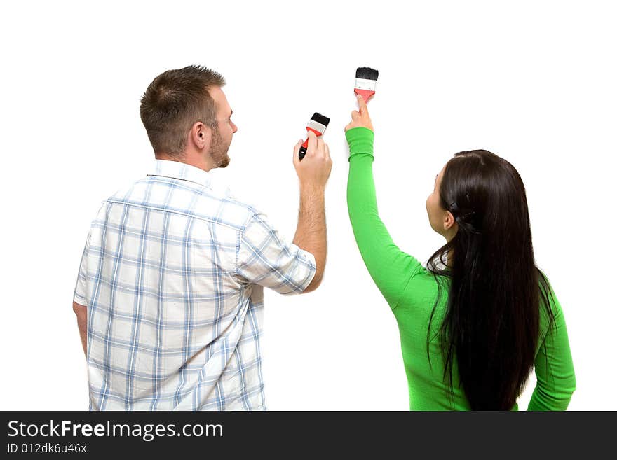 Happy casual couple painting wall. Happy casual couple painting wall