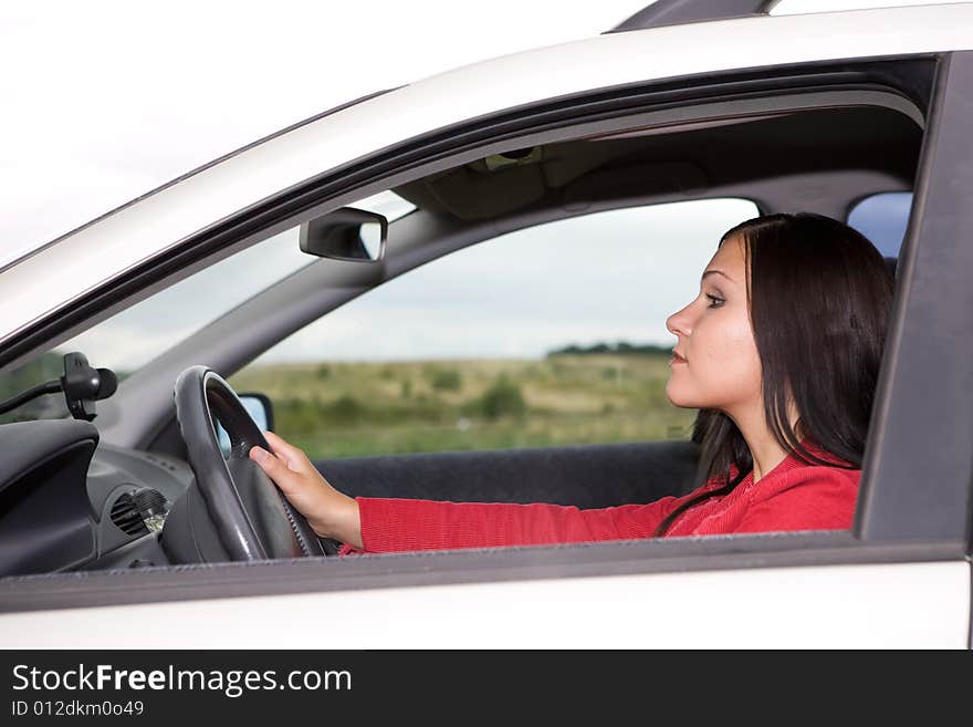 Attractive brunette woman traveling by car. Attractive brunette woman traveling by car