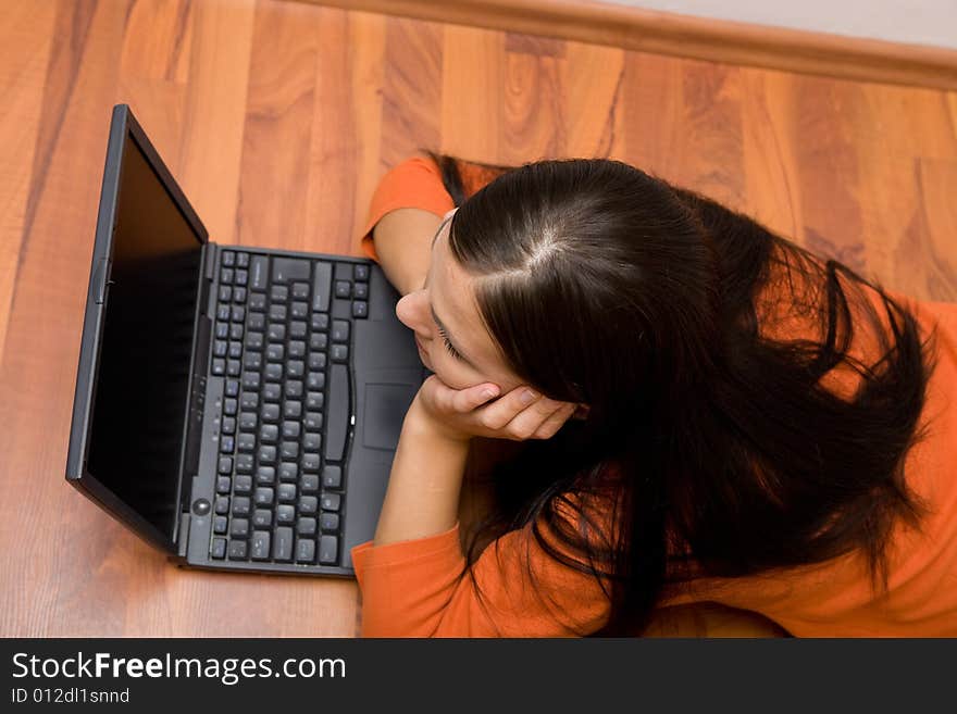 Casual woman lying on flor with laptop. Casual woman lying on flor with laptop