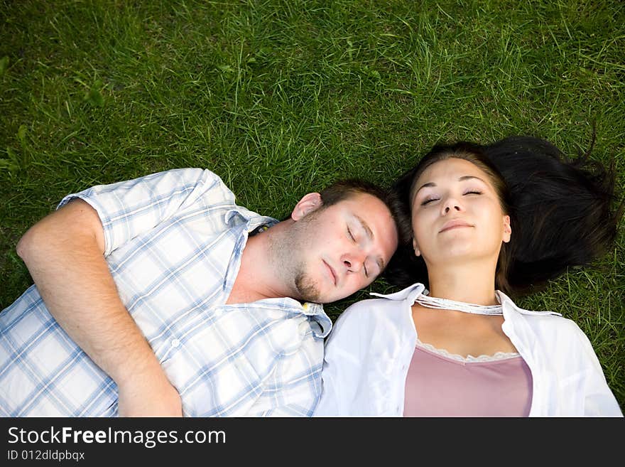 Happy couple lying on grass. Happy couple lying on grass