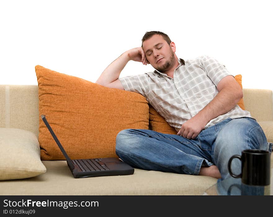 Happy man sitting on sofa with laptop. Happy man sitting on sofa with laptop