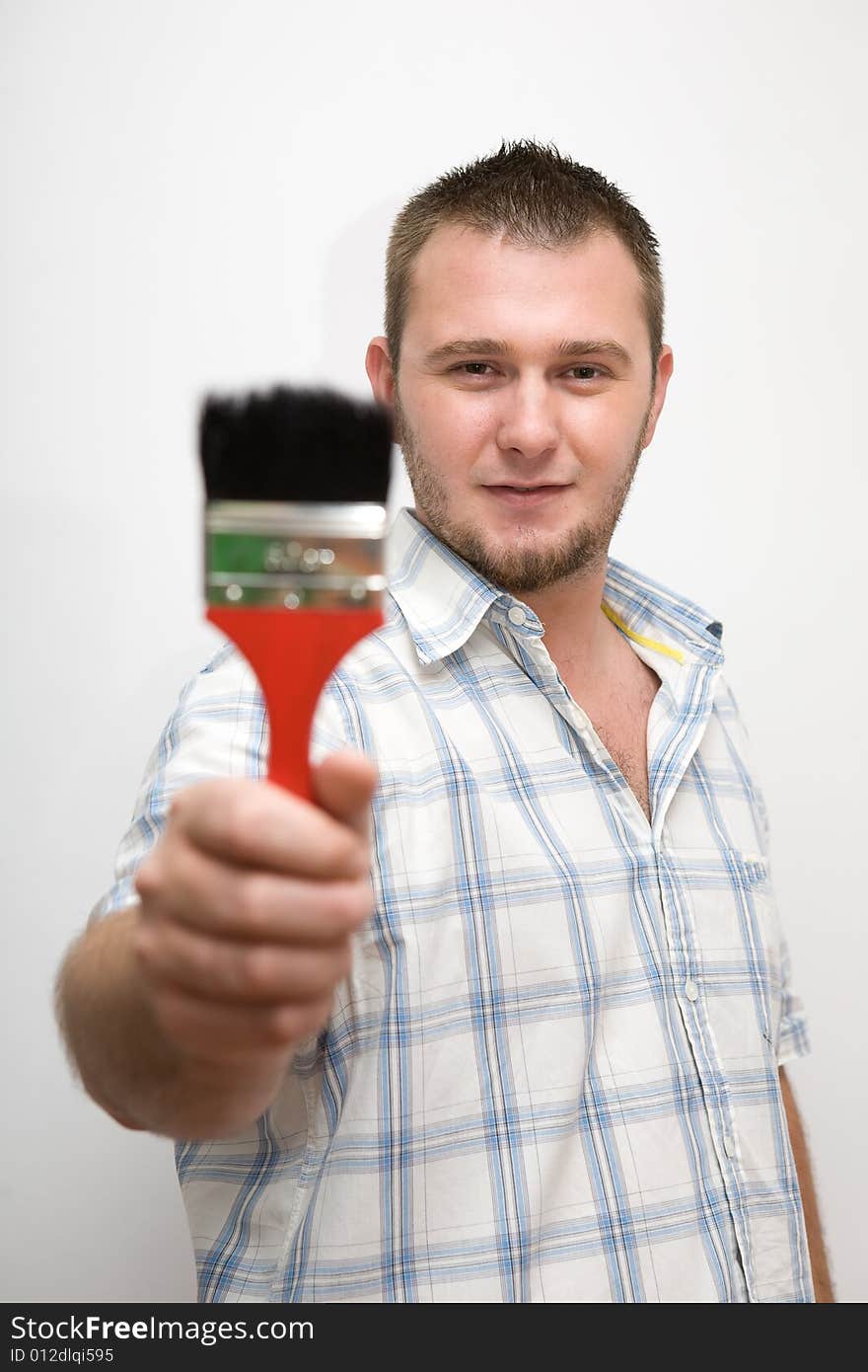 Happy casual man with paintbrush. Happy casual man with paintbrush