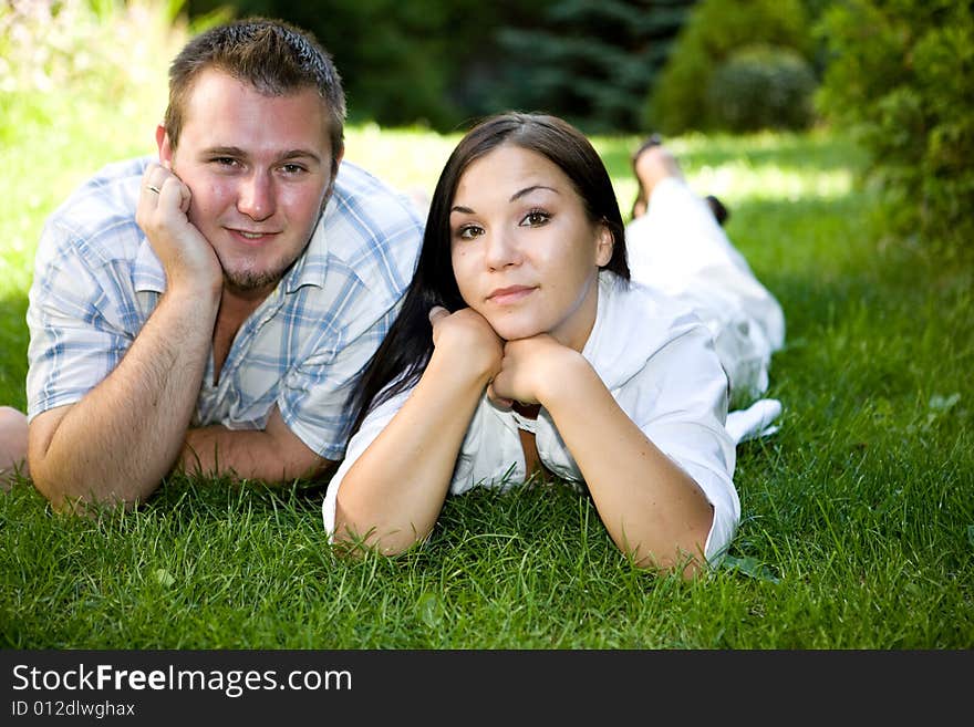 Happy couple lying on grass. Happy couple lying on grass