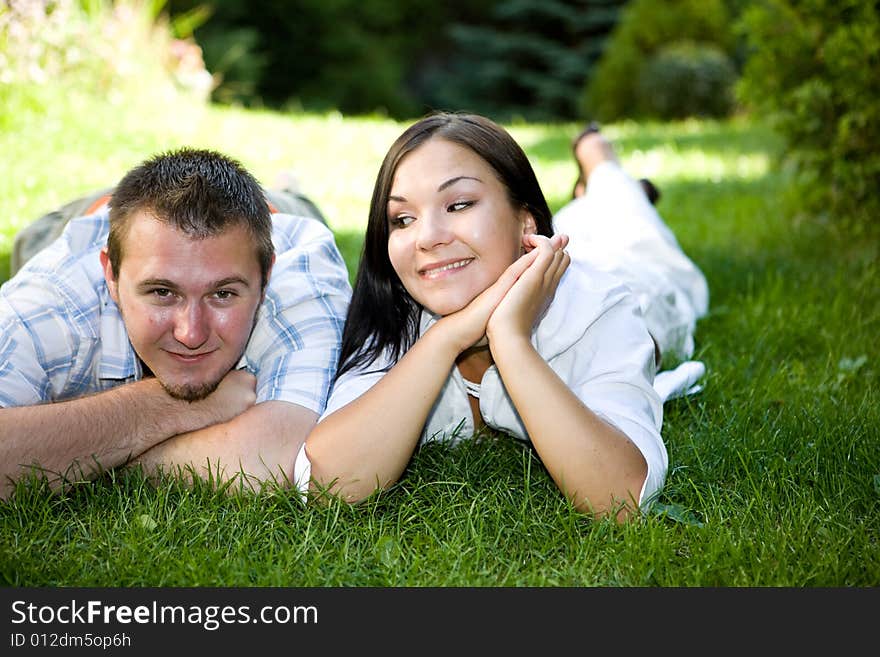 Happy couple lying on grass. Happy couple lying on grass