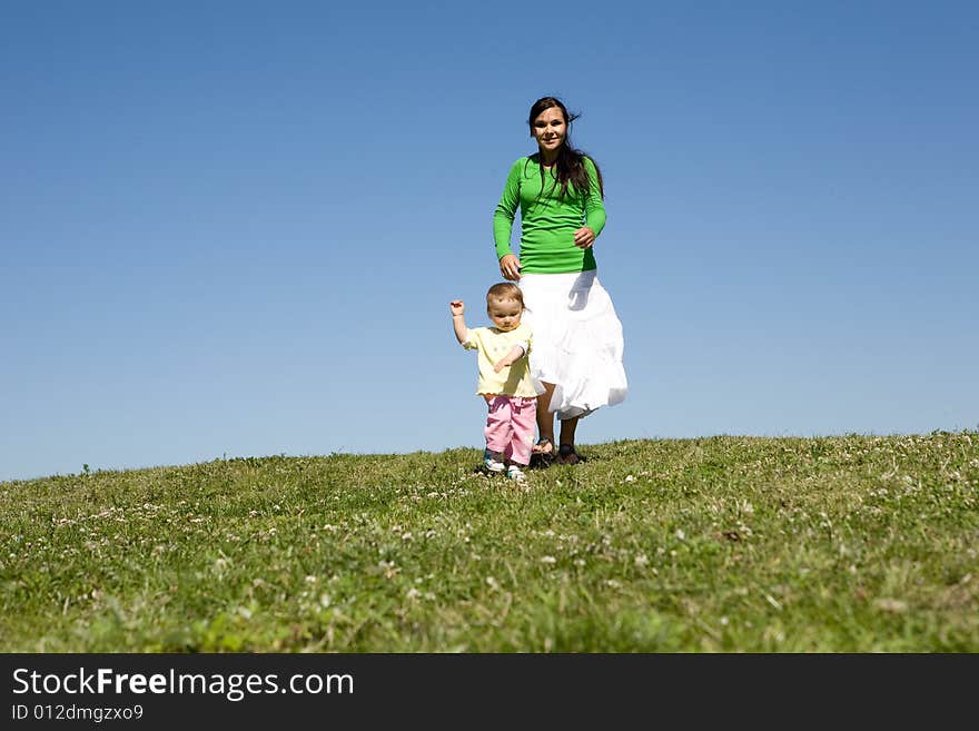 Active family on green meadow. Active family on green meadow