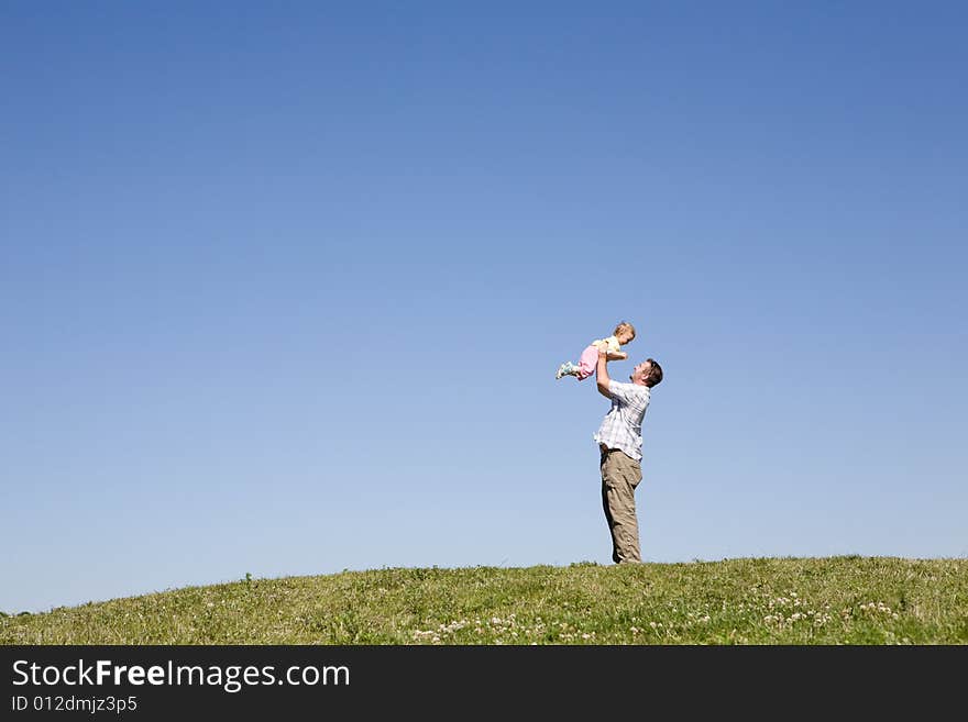 Active family on green meadow. Active family on green meadow