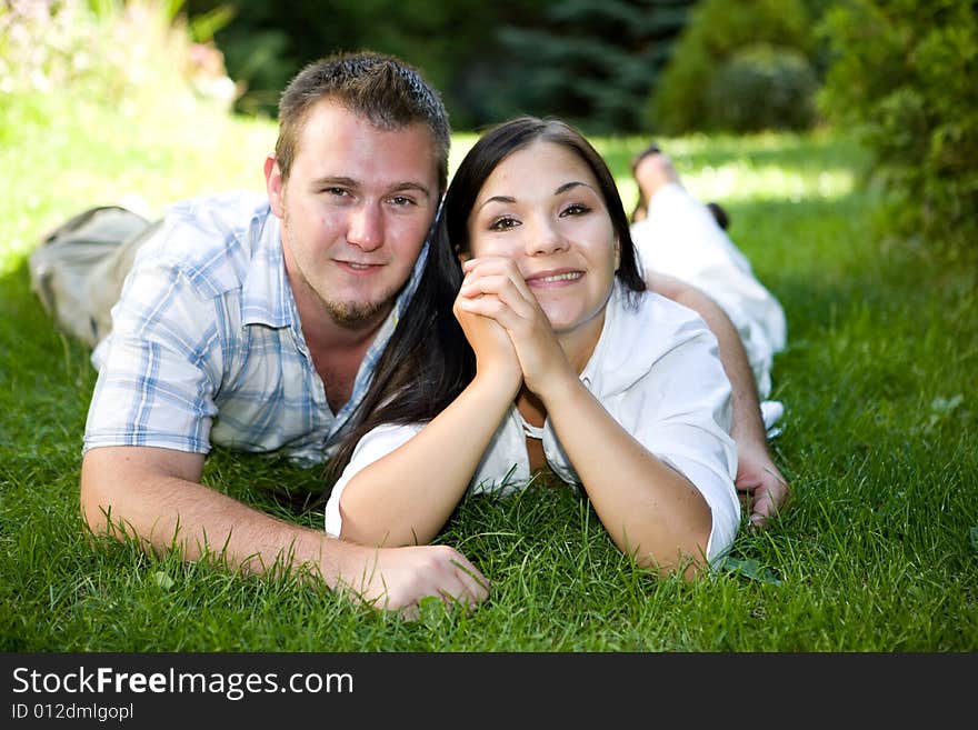 Happy couple lying on grass. Happy couple lying on grass