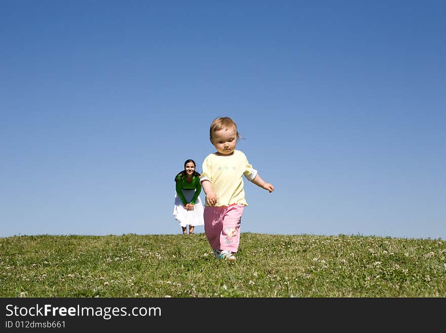 Active family on green meadow. Active family on green meadow