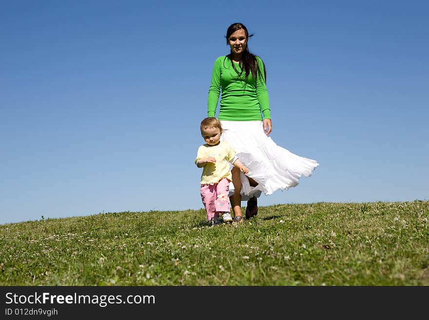 Active family on green meadow. Active family on green meadow