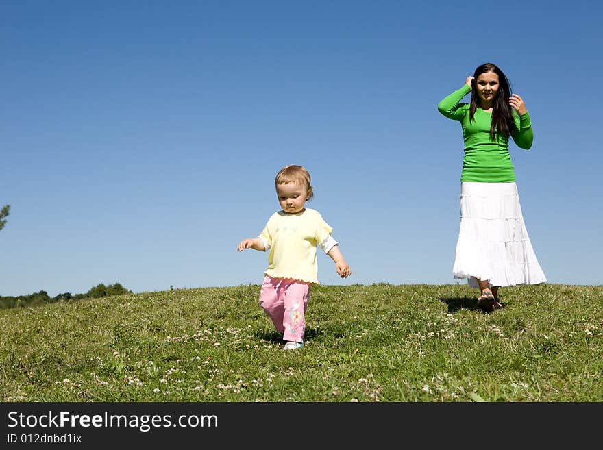 Active family on green meadow. Active family on green meadow