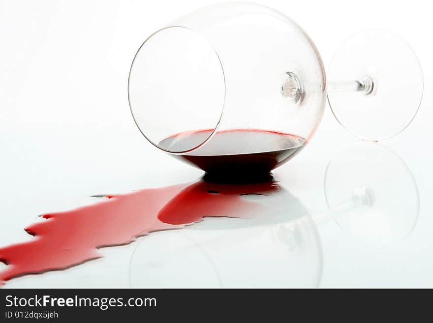 Wine glass with red wine falled down. Wine glass with red wine falled down