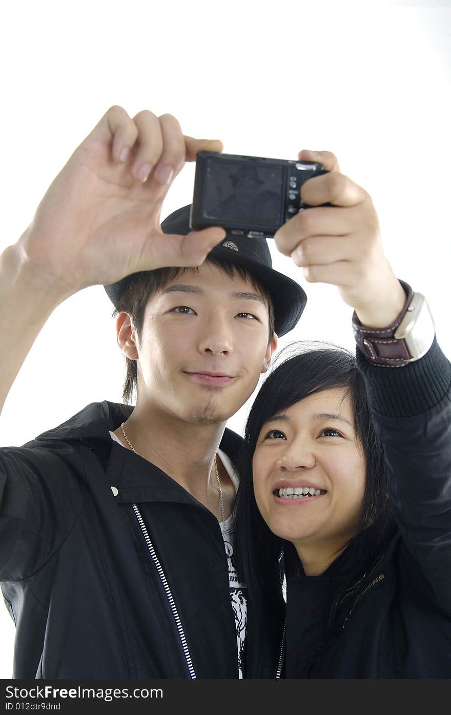 An attractive couple together taking a selfportrait