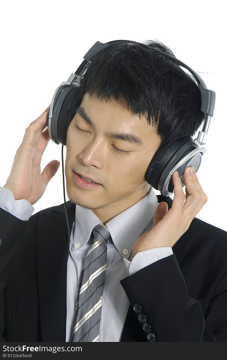 Business man listening to music, isolated in white background