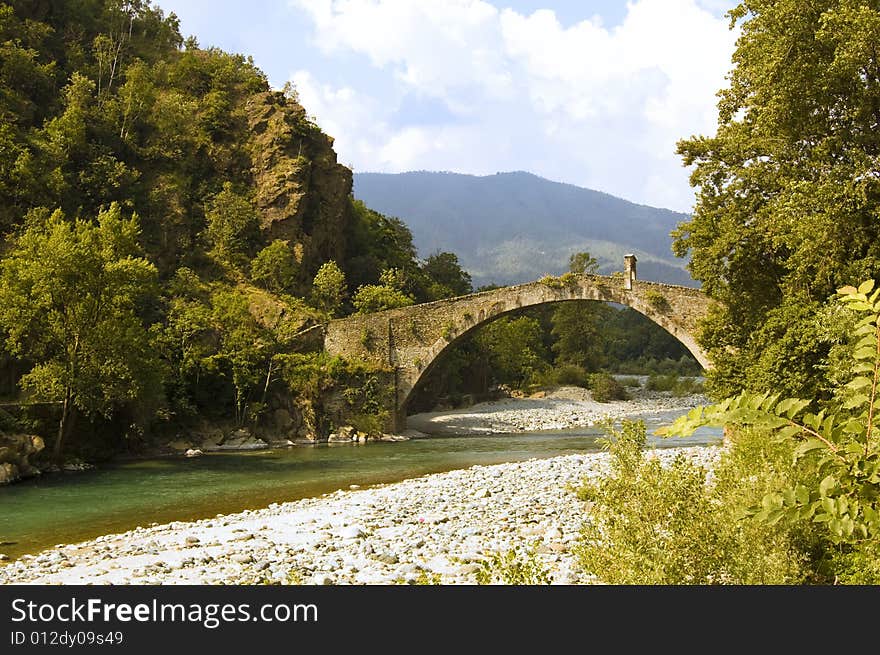 The legend says that It was the devil that built this bridge over the green waters of river Stura (Italy). The legend says that It was the devil that built this bridge over the green waters of river Stura (Italy).