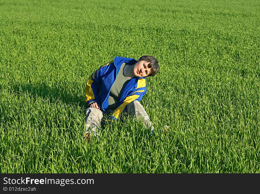 A woman have a rest on a field