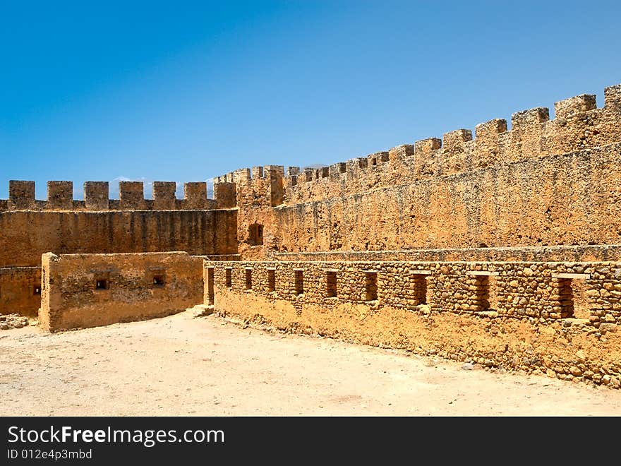 Walls of the typical mediterranean fortress. Southern seacoast of Crete. Walls of the typical mediterranean fortress. Southern seacoast of Crete.