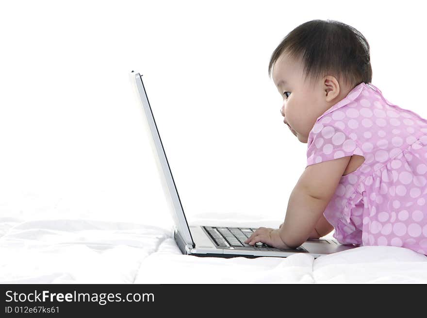 Small baby with laptop isolated. Small baby with laptop isolated