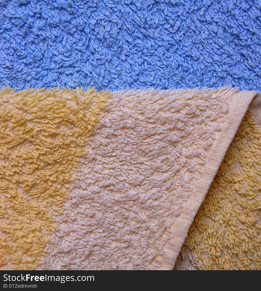 A detail of a blue and yellow towel. A detail of a blue and yellow towel