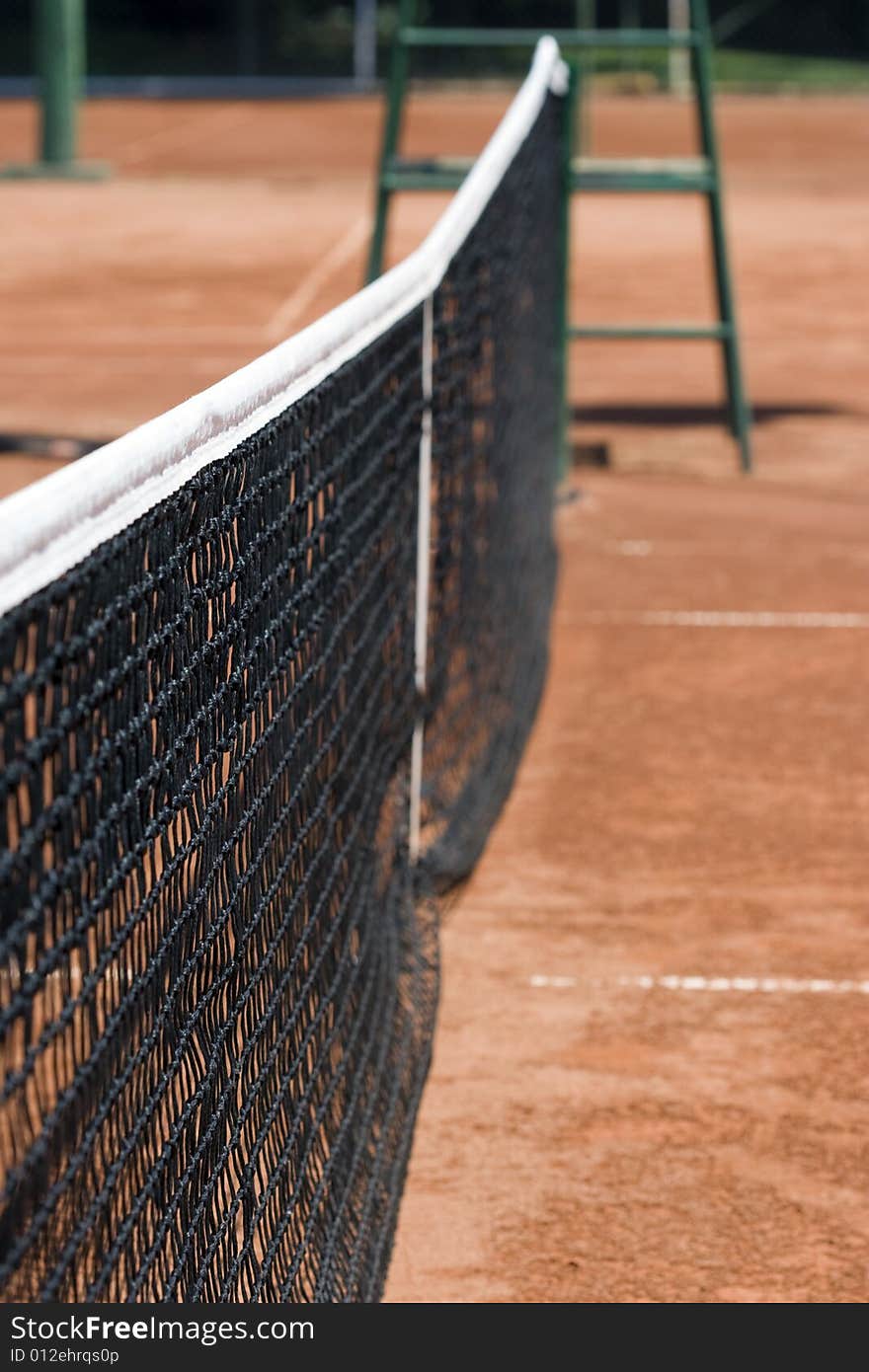 Tennis net on the tennis clay court