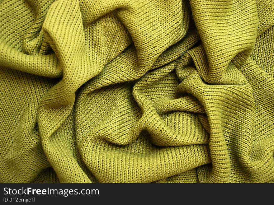 A detail of a green sweater