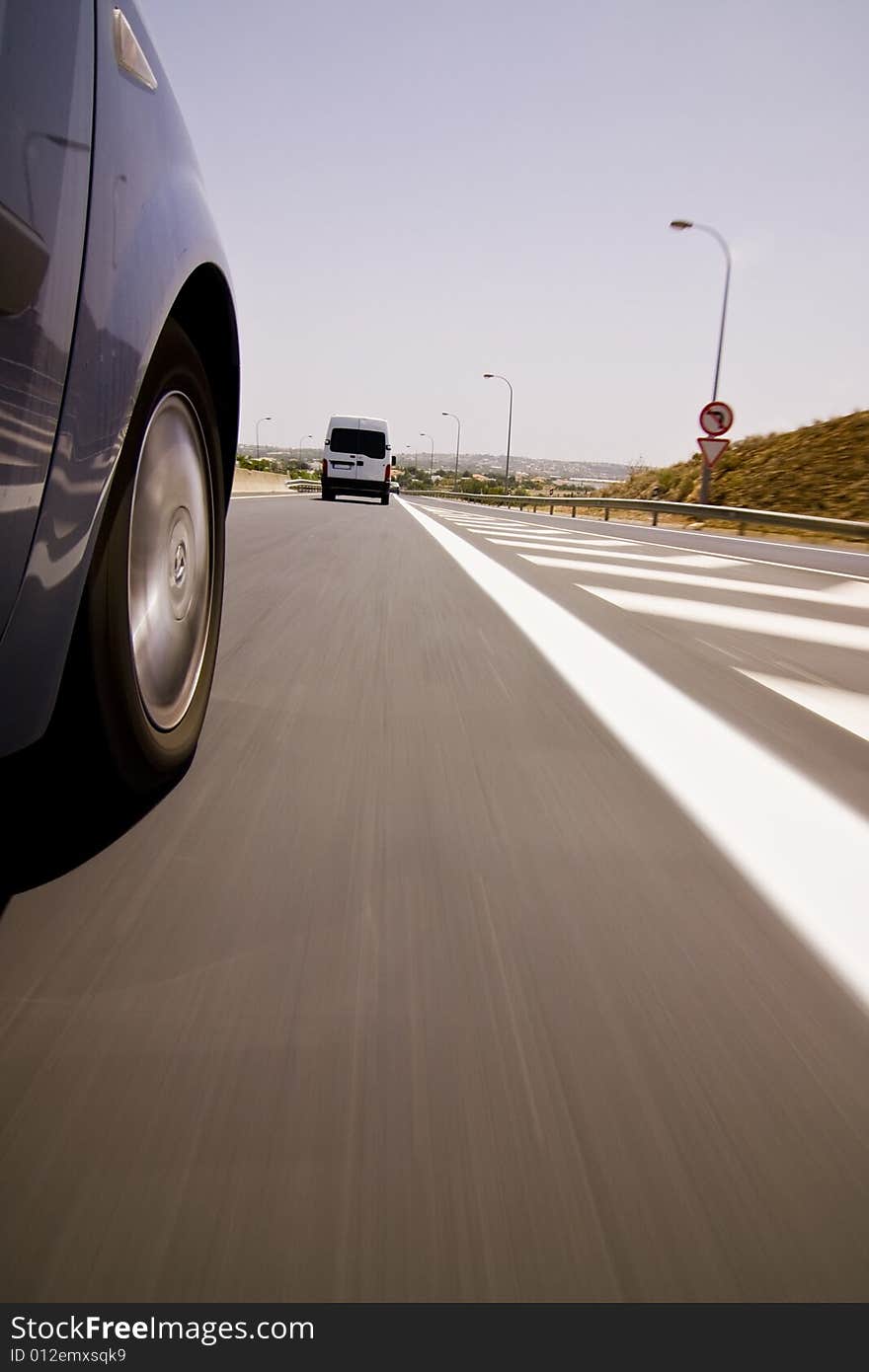 Blue car chasing a van at high speed. Blue car chasing a van at high speed.