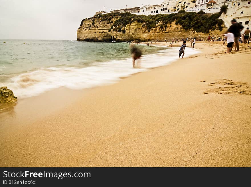 Long exposure at Carvoeiro beach, south of Portugal. Unrecognizable faces.