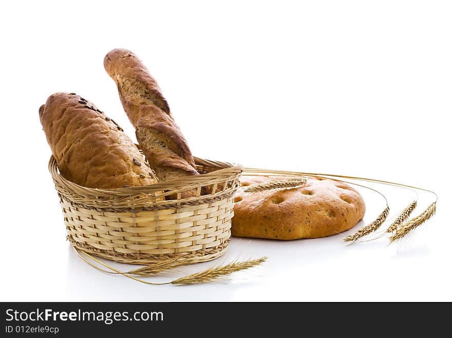 Various fresh baked goods with ears of wheat. Various fresh baked goods with ears of wheat