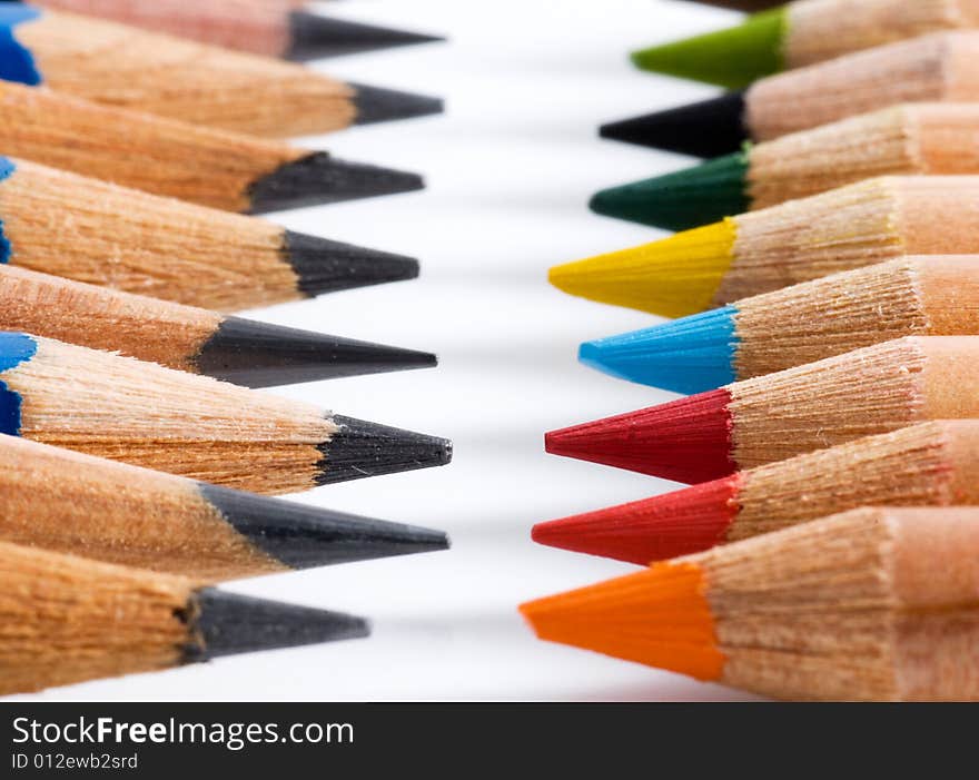 Many pencils of different colors in two rows. Many pencils of different colors in two rows