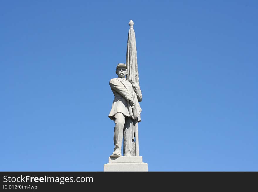 Statue of a man on a beautiful blue sky background