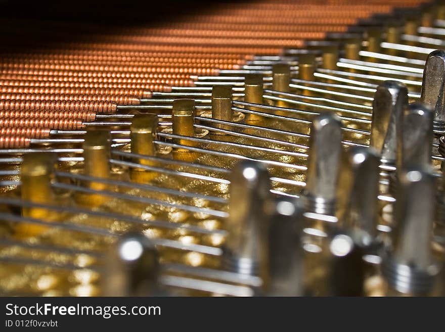 Interior of a piano, wires close-up. Horizontal shoot. Interior of a piano, wires close-up. Horizontal shoot