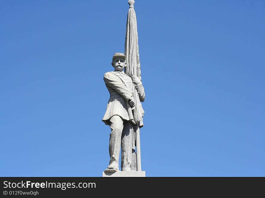 Statue of a man on a beautiful blue sky background