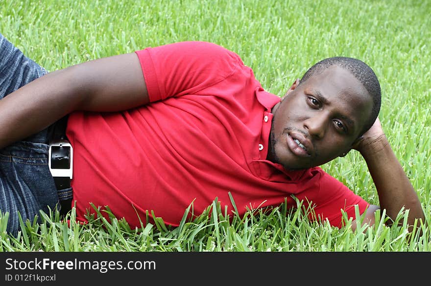 Man Laying on Green grass