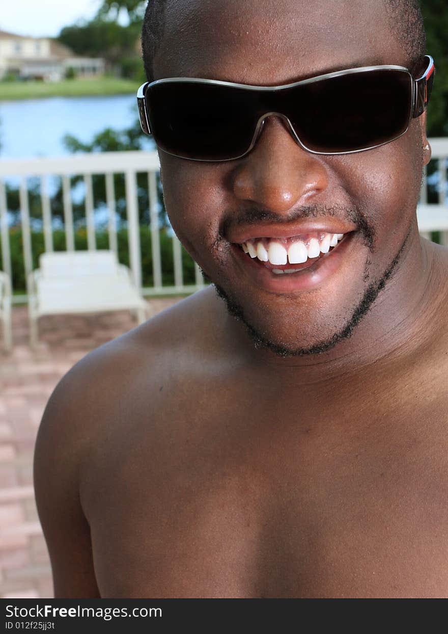 Man smiling and wearing shades. Man smiling and wearing shades.