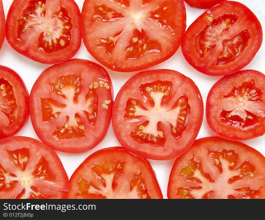 Slice of tomato, isolated on white. Slice of tomato, isolated on white