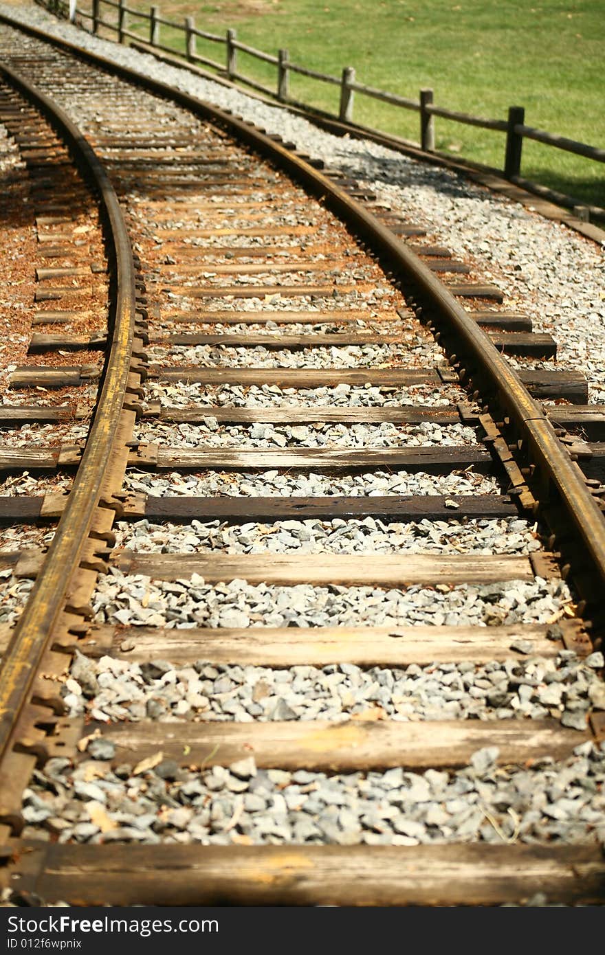 Curving Rail Road Tracks In Park