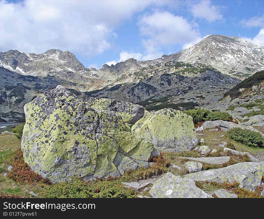 Classical Landscape Of Mountain Ridge With Lichen-Covered Boulders In Foreground Retezat National Park Romania. Classical Landscape Of Mountain Ridge With Lichen-Covered Boulders In Foreground Retezat National Park Romania.