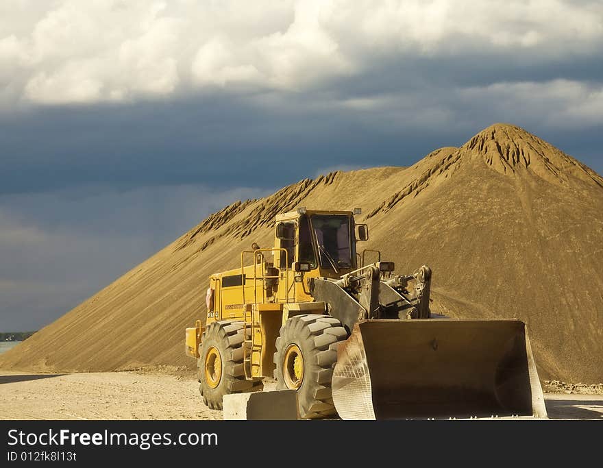 Bulldozer on a construction site by Detroit river