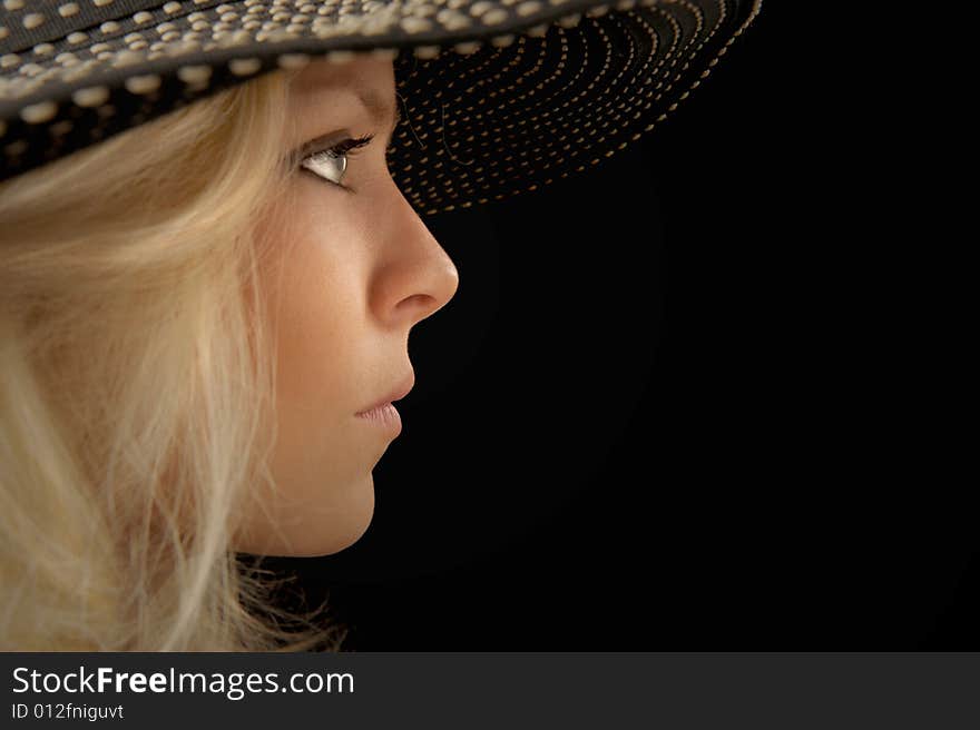 Beautiful Image of a woman in a hat On Black. Beautiful Image of a woman in a hat On Black