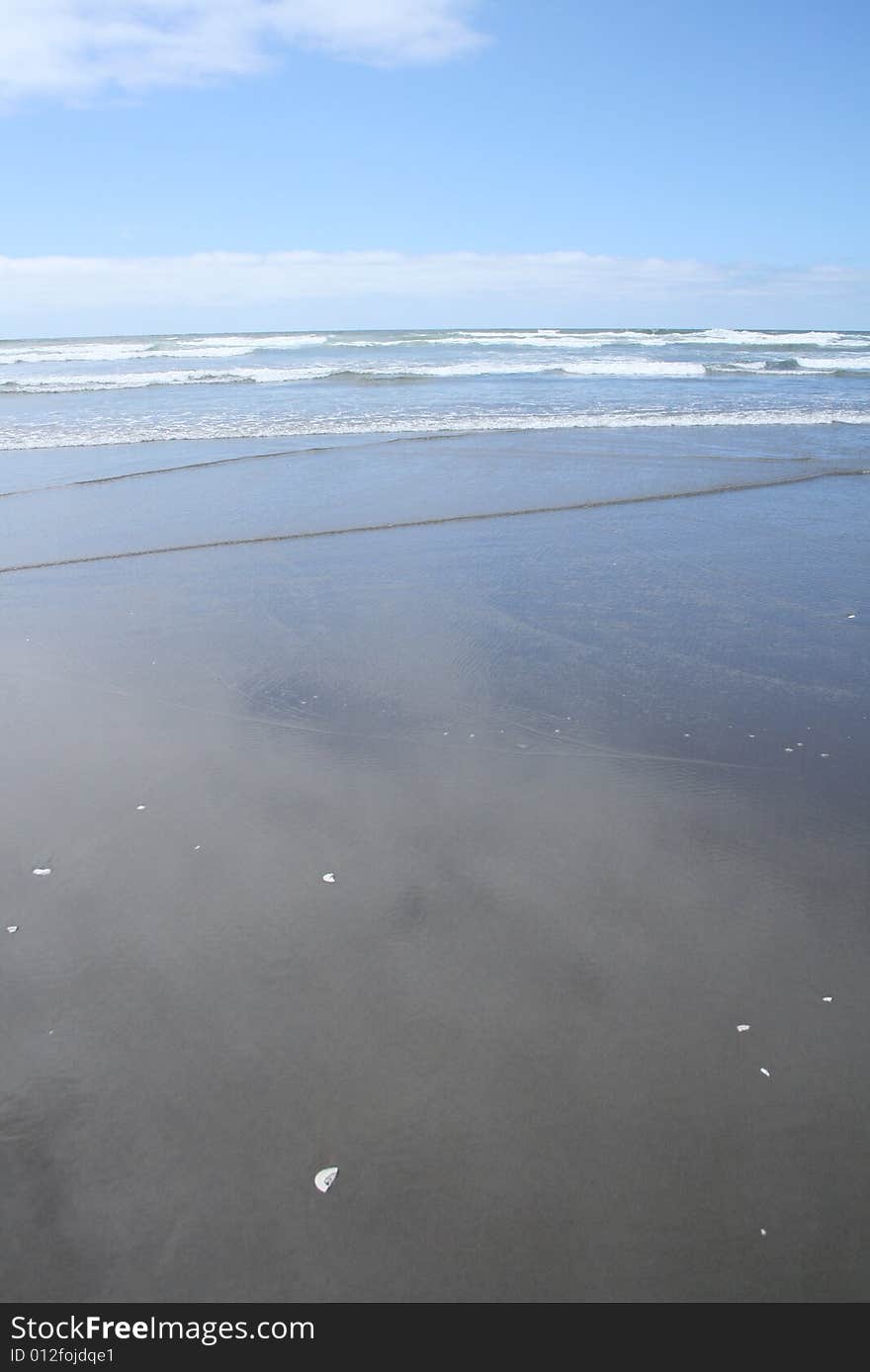 A sandy ocean shore on the Oregon coast.