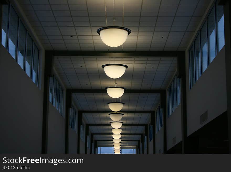 Lights in a line indoors in a conference center.