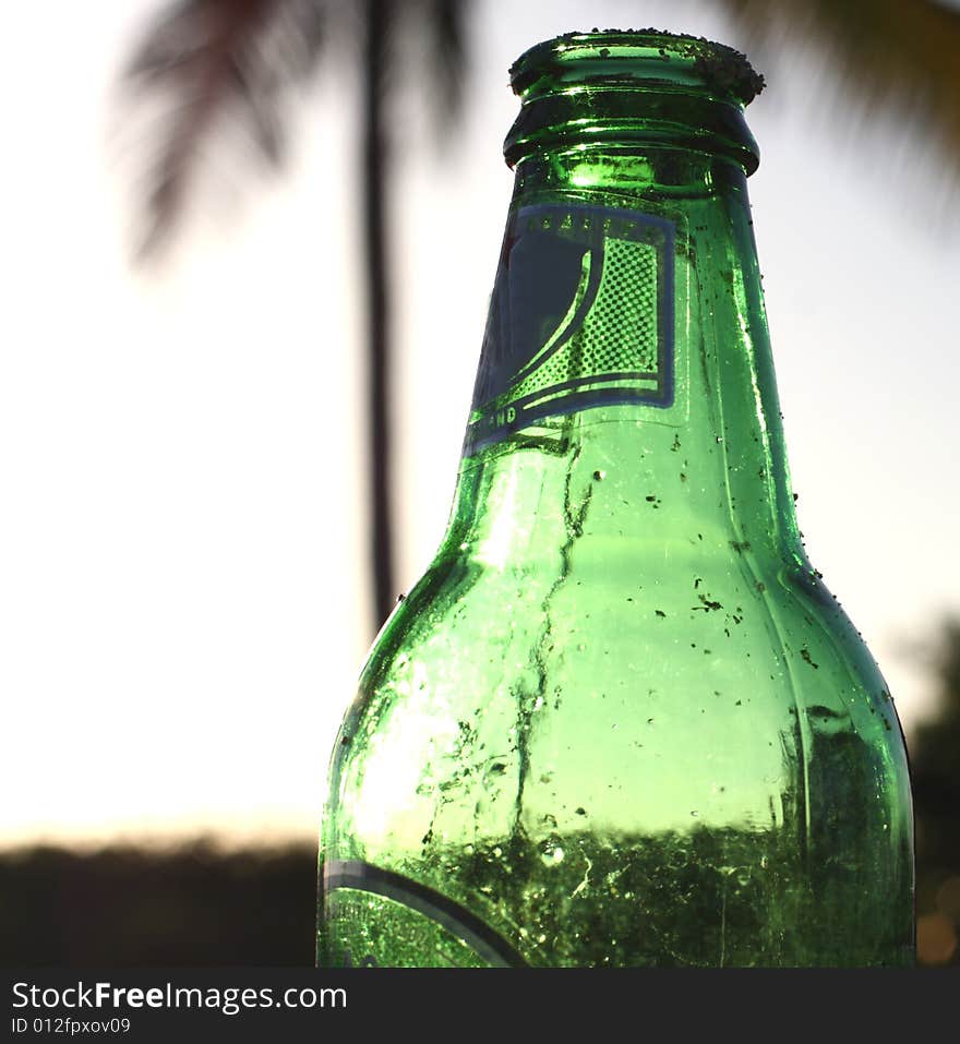 Green empty beer bottle closeup