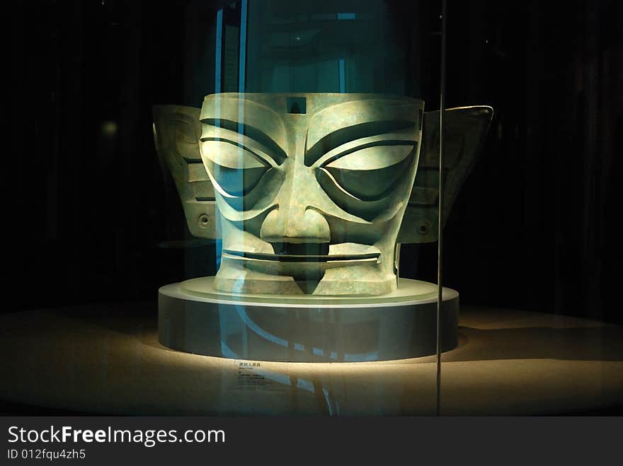 The site of Sanxingdui, located in the city of Guanghan, 40 km from Chengdu, Sichuan Province, is recognized as one of the most important ancient remains in the world for its vast size, lengthy period and enriched cultural contents.

The first Sanxingdui relics were discovered by a farmer in 1929 and excavation has continued ever since. During this period, generations of archaeologists have worked on the discovery and research of the Sanxingdui culture. In 1986, two major sacrificial pits were found and they aroused widespread academic attention around the world.

The Sanxingdui finds are exciting, but they remain enigmatic. No texts have been found, nor is there any mention of this culture in the records of other countries. Analysis of lead and other elements in the bronzes indicates sources similar to those of other cultures along the lower reaches of the Yangtze River. At this point, however, the unique culture that produced these artifacts remains a mystery. The site of Sanxingdui, located in the city of Guanghan, 40 km from Chengdu, Sichuan Province, is recognized as one of the most important ancient remains in the world for its vast size, lengthy period and enriched cultural contents.

The first Sanxingdui relics were discovered by a farmer in 1929 and excavation has continued ever since. During this period, generations of archaeologists have worked on the discovery and research of the Sanxingdui culture. In 1986, two major sacrificial pits were found and they aroused widespread academic attention around the world.

The Sanxingdui finds are exciting, but they remain enigmatic. No texts have been found, nor is there any mention of this culture in the records of other countries. Analysis of lead and other elements in the bronzes indicates sources similar to those of other cultures along the lower reaches of the Yangtze River. At this point, however, the unique culture that produced these artifacts remains a mystery.