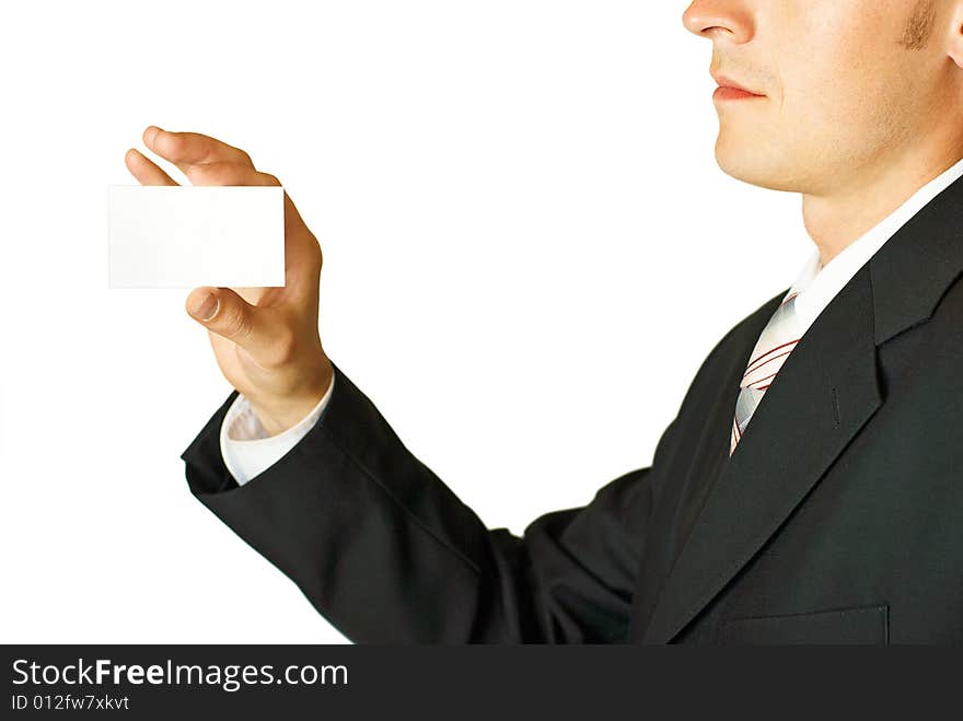 Young businessman holding blank visit card. Backside. Isolated. Young businessman holding blank visit card. Backside. Isolated.