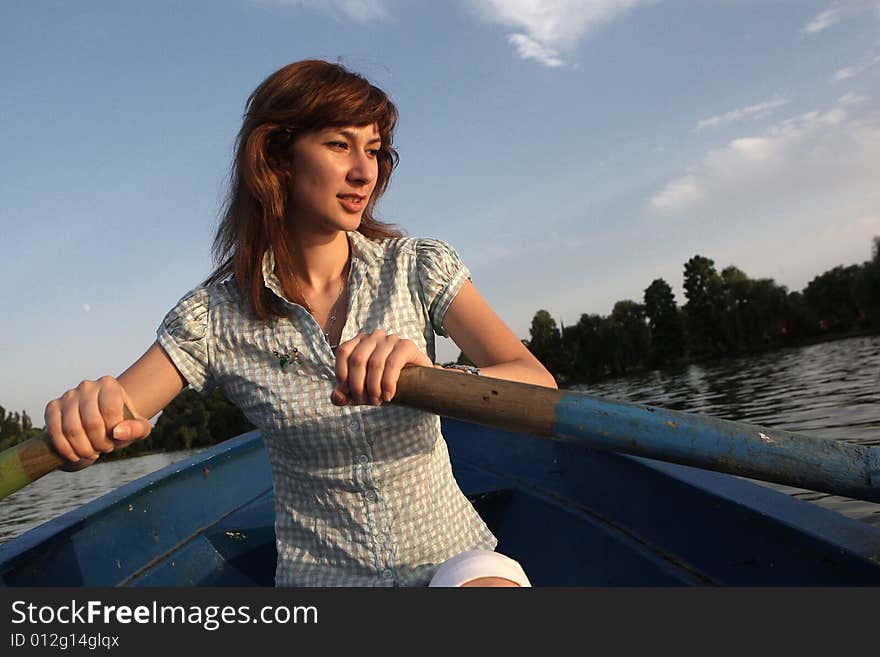 Girl rowing a boat