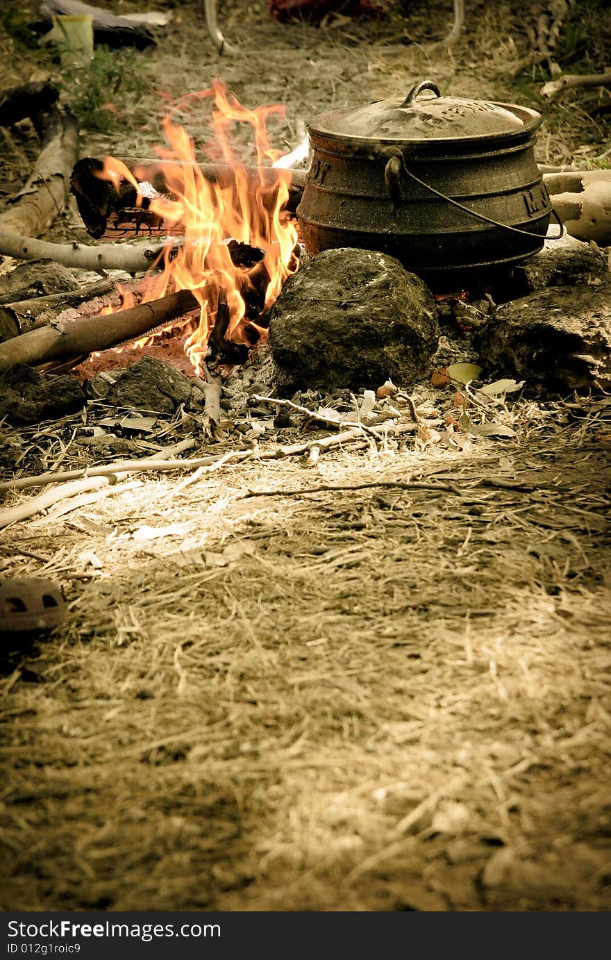 A pot biols on the fire. A pot biols on the fire