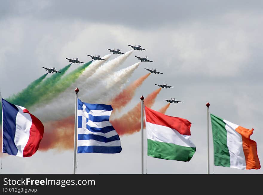 Planes with smoke, italian colours and flags on the front