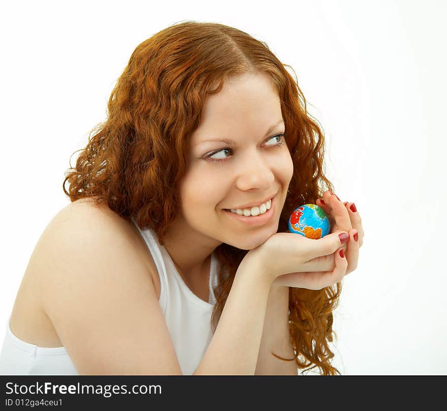 The young girl holds a small copy of globe in hands, expresses the support. The young girl holds a small copy of globe in hands, expresses the support