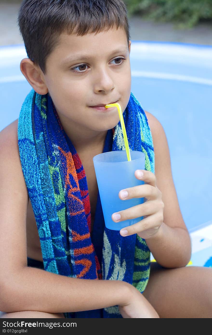 Cute young boy drink juice