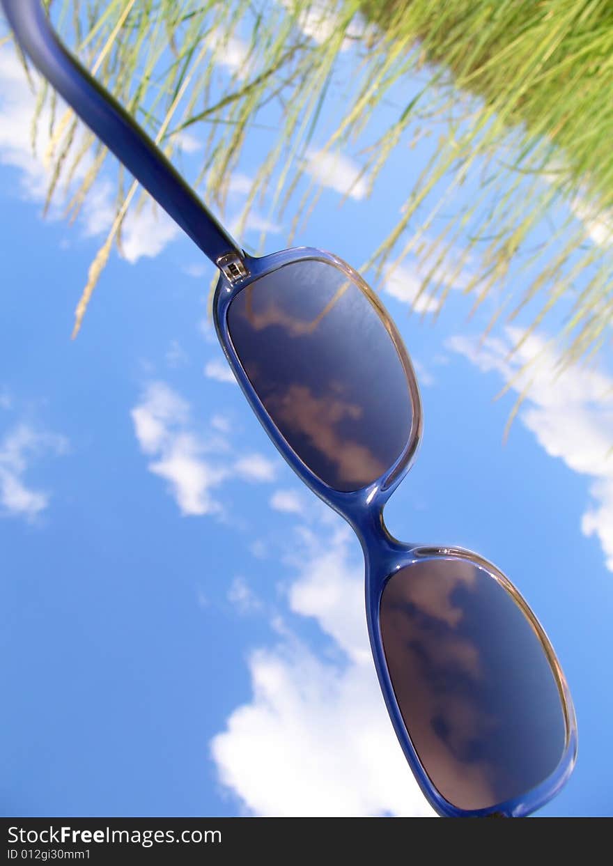 Solar glasses and sky